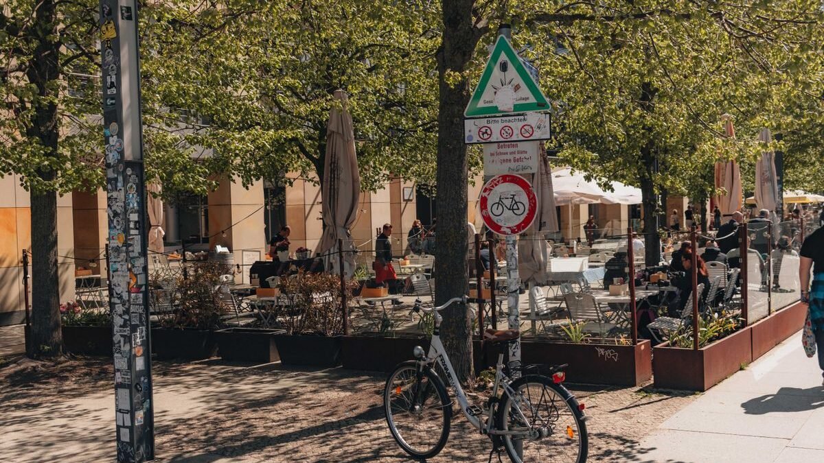 Bicycle parked in a lively cafe scene