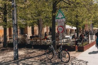 Bicycle parked in a lively cafe scene