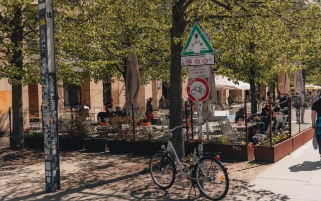 Bicycle parked in a lively cafe scene