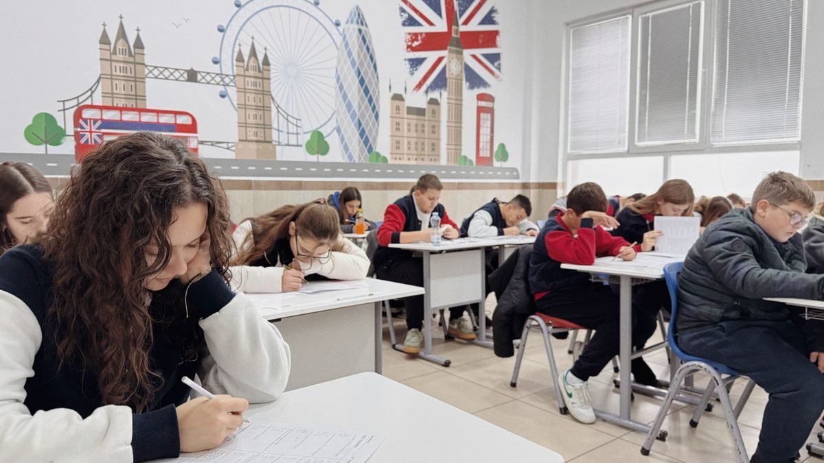 Students focus on an English class study session in a London-themed classroom