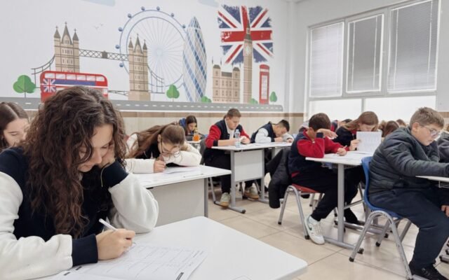 Students focus on an English class study session in a London-themed classroom