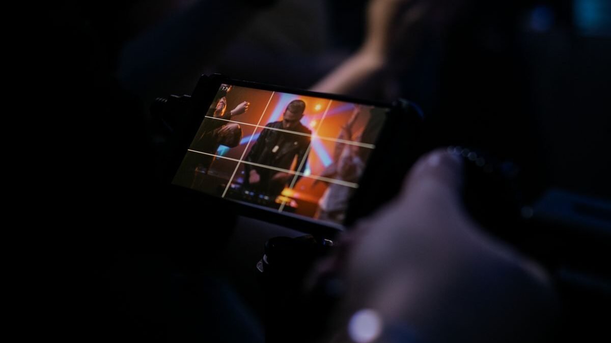 showing vibrant stage lighting and an enthusiastic audience