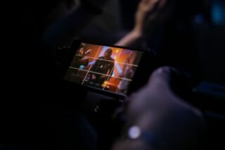 showing vibrant stage lighting and an enthusiastic audience
