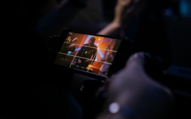 showing vibrant stage lighting and an enthusiastic audience