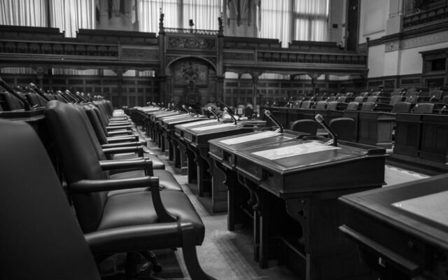 Black and white photo of a traditional legislative assembly chamber