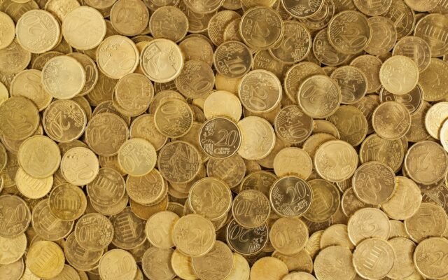 A close-up shot of Euro coins scattered in a pile