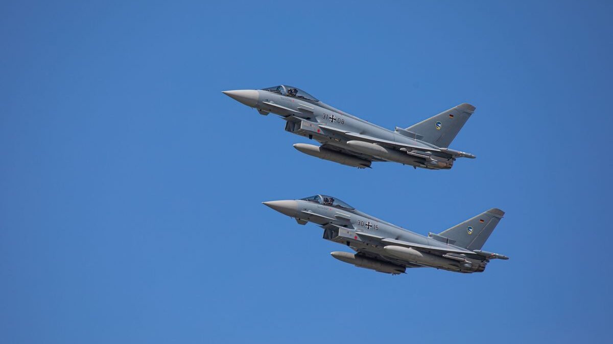 German Air Force Eurofighter Typhoons soaring in clear Slovakian sky
