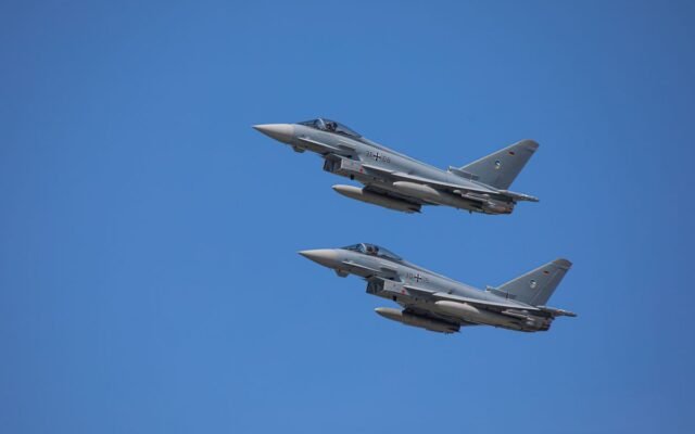 German Air Force Eurofighter Typhoons soaring in clear Slovakian sky