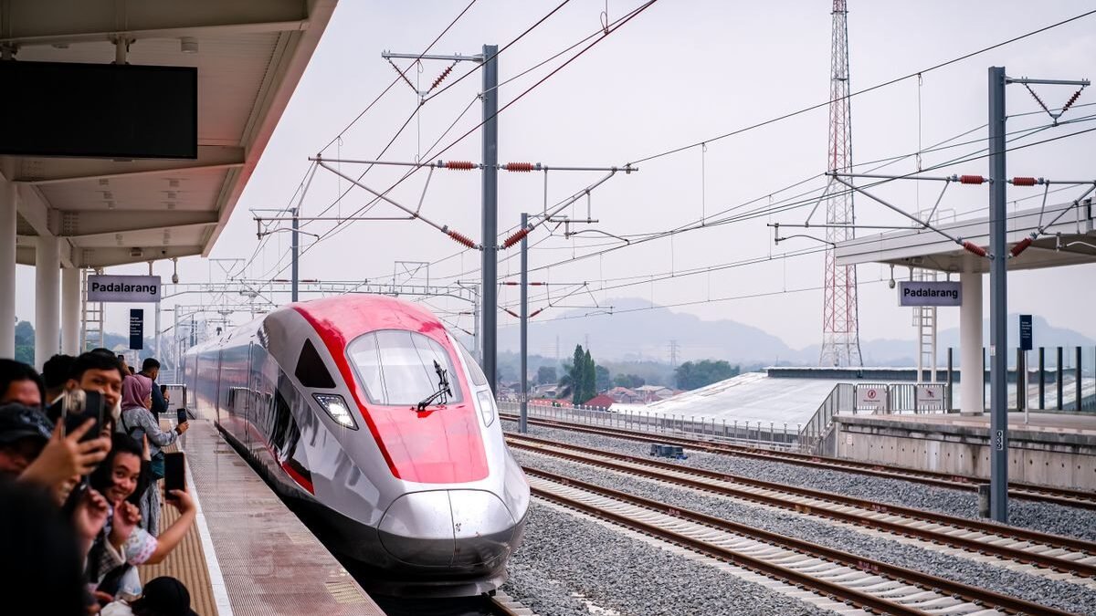 A sleek high-speed train arriving at Station