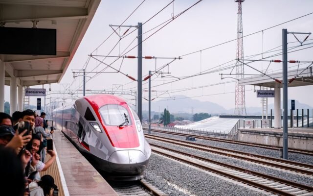 A sleek high-speed train arriving at Station