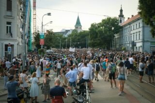 A large peaceful protest unfolds in city streets