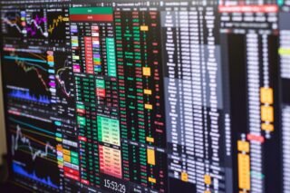 Detailed financial trading screen with colorful charts and data representing market fluctuations