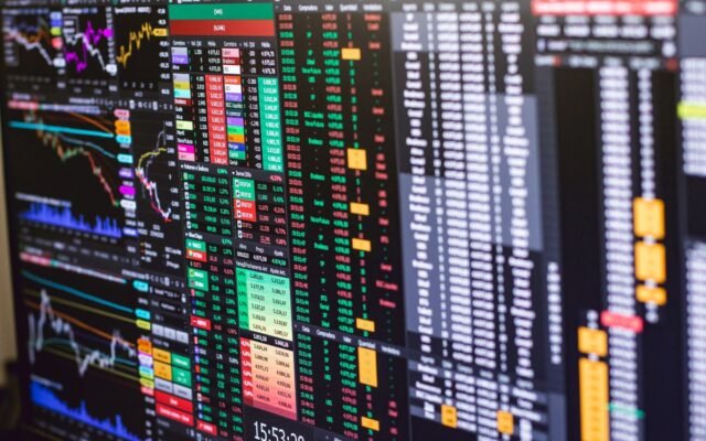 Detailed financial trading screen with colorful charts and data representing market fluctuations